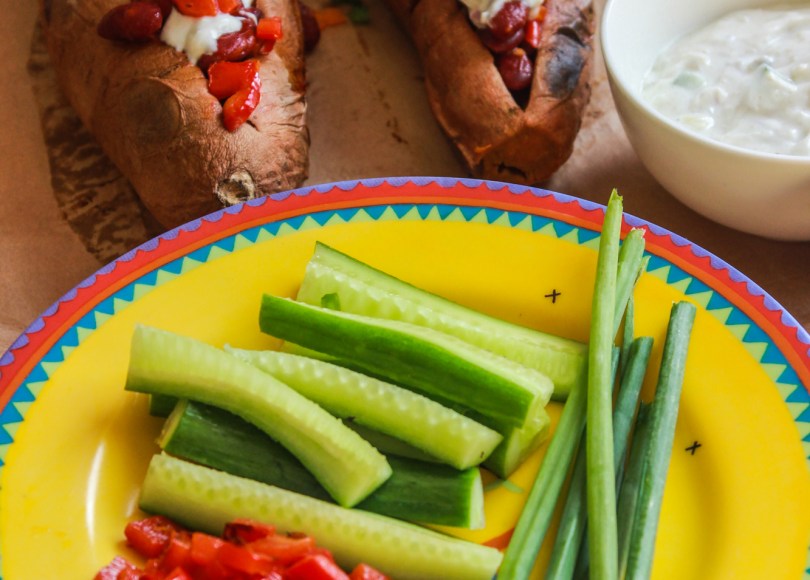 photo of Baked sweet potato with beans and tzatziki sauce