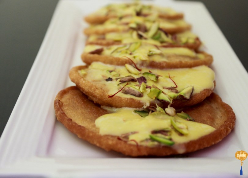 photo of Malpua with Saffron Rabri