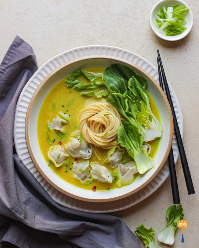 chicken dumpling with turmeric and coconut soup