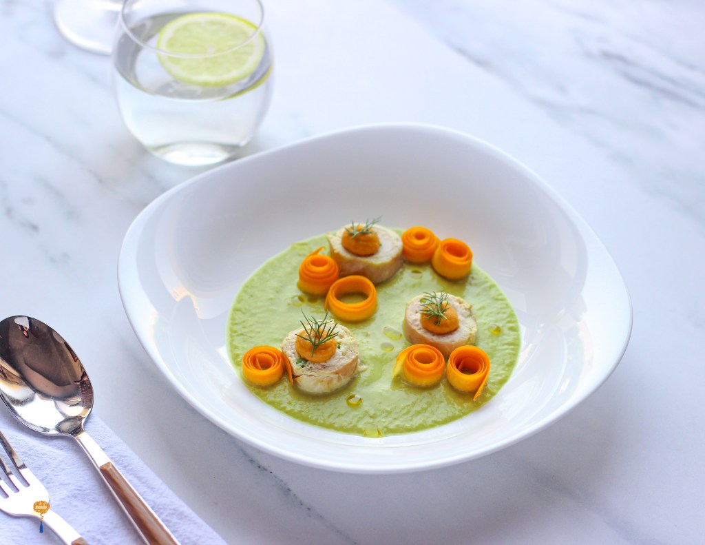 chicken roulade with herb cottage cheese filling served with yellow zucchini and carrot sauce 