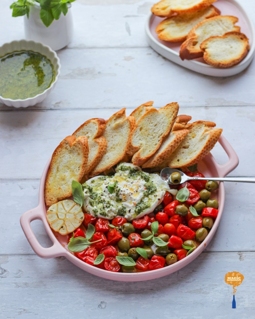 thyme roasted cherry tomatoes and olives with burrata