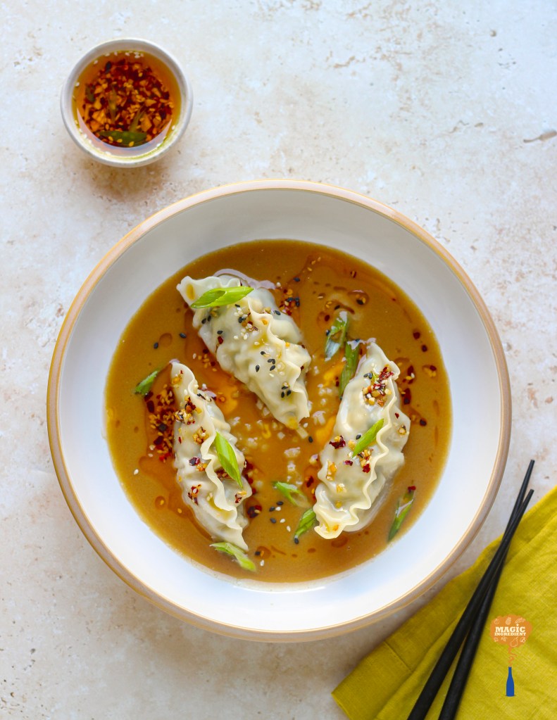 Dumplings in peanut butter sauce with chili oil