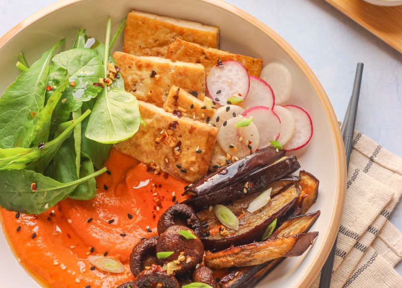 baked vegetables with a creamy red pepper sauce, pan fried tofu and chili oil