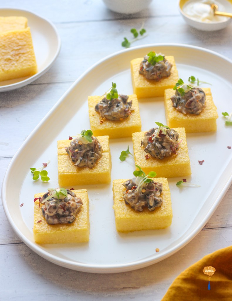 Polenta canapés with creamy thyme mushrooms