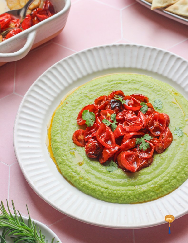 herb hummus with roasted cherry tomatoes and Rosemary pink salt crackers