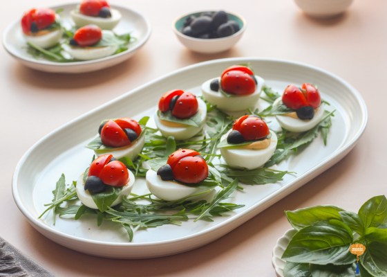 Devilled eggs with cherry tomato ladybugs