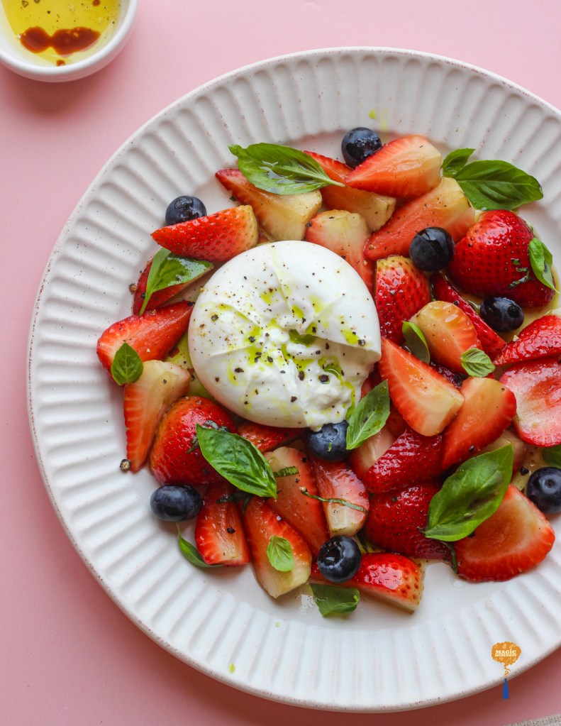 Strawberry and blueberries salad with burrata and balsamic dressing